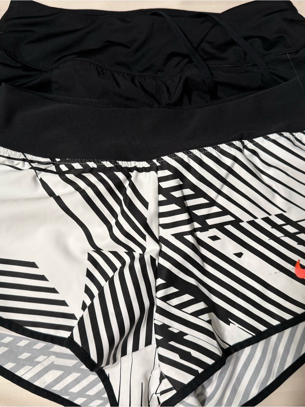 Nike Black & White Striped Women’s Athletic Shorts with Orange Swoosh. 2 pair.